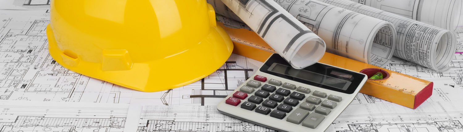 Yellow helmet, calculator, level and project drawings